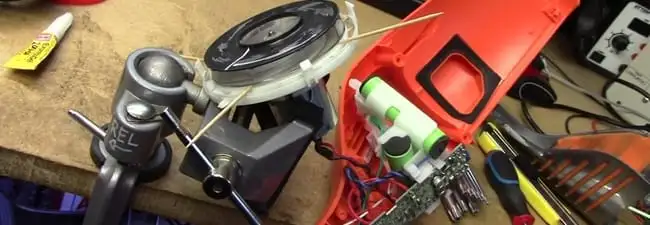 Vacuum cleaner repair parts and tools on a workbench in Henderson, NV